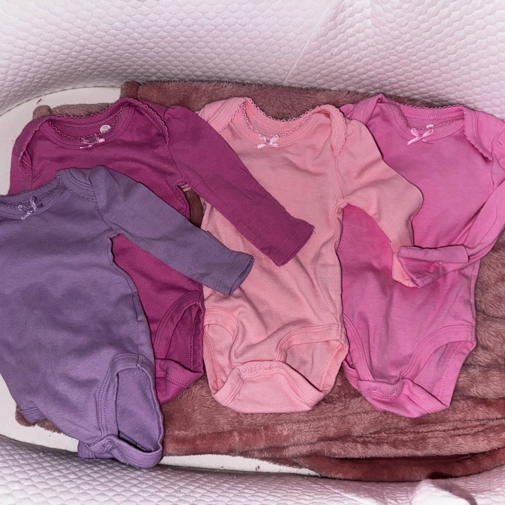 Pack of Pink and Purple newborn One Pieces